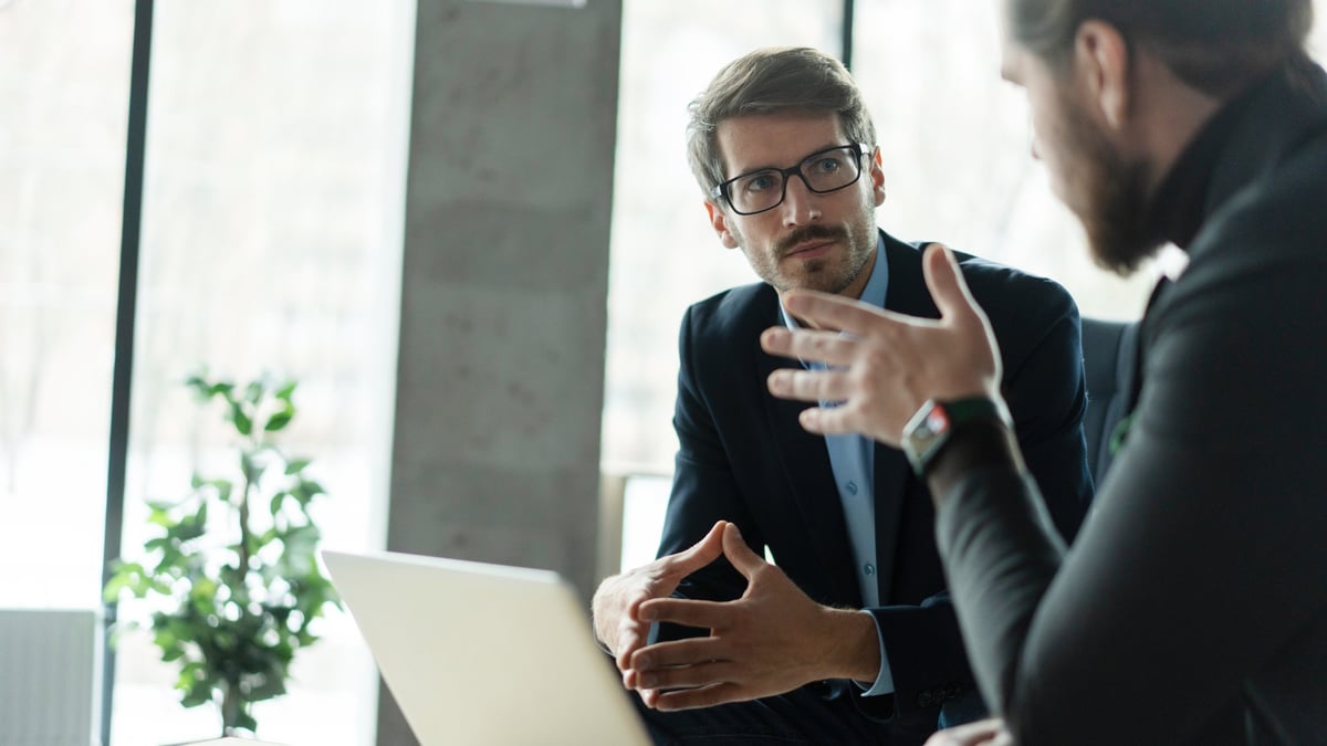 Business partners negotiating a deal in a modern office